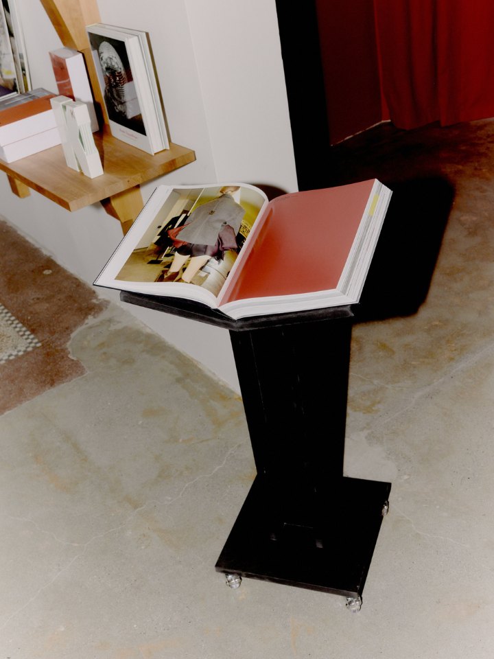 An open book on a lectern by the Red Room at Simone
