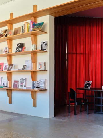 Cherry wood shelving and the Red Room